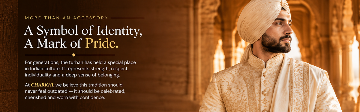 A promotional banner with text on the left reading 'A Symbol of Pride, A Mark of Pride.' and 'More than an accessory,' alongside a man in traditional Indian attire wearing a cream-colored turban and embroidered cream shirt, standing in an ornate golden interior.